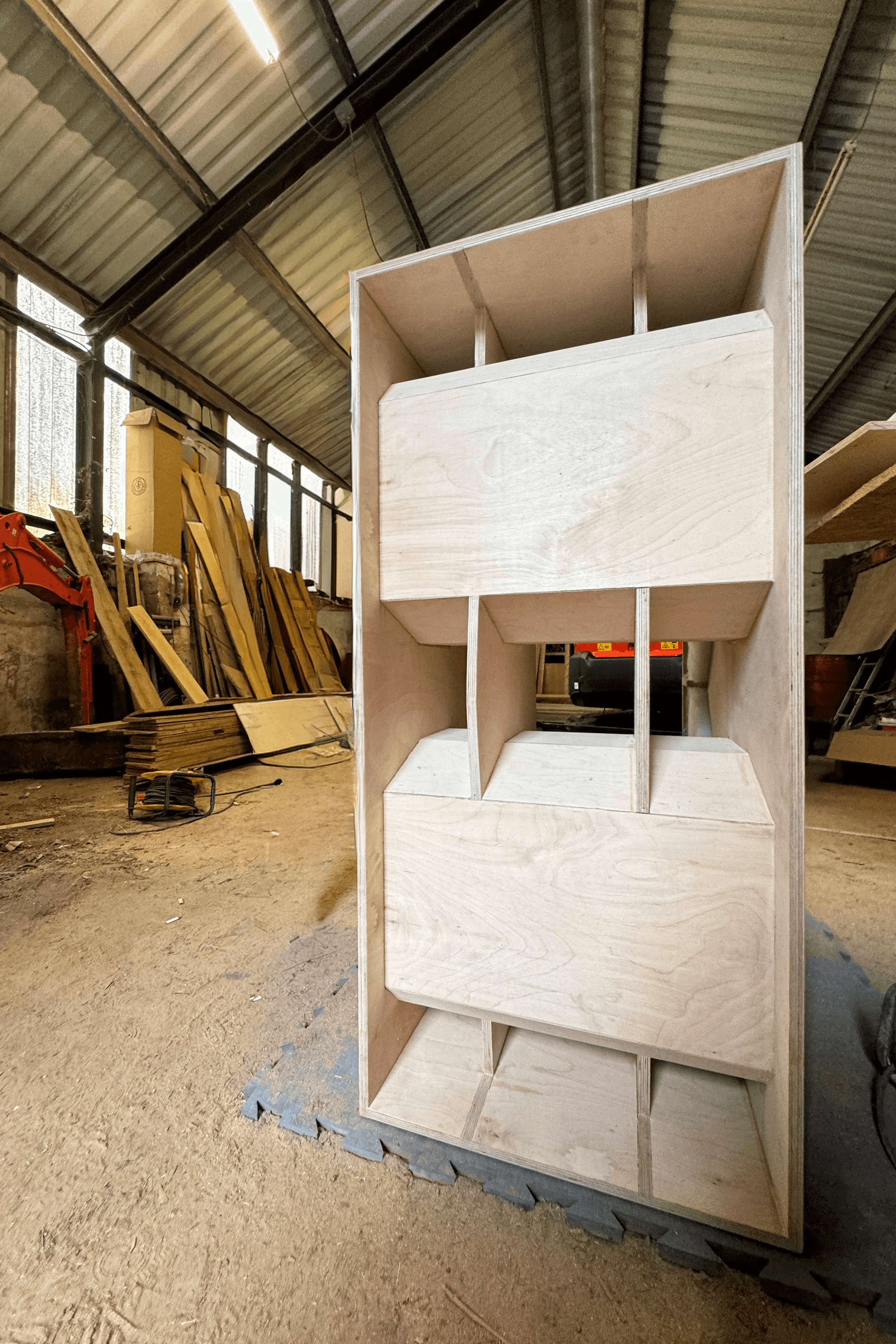 S218BP subwoofer flatpack - upright view showing internal bracing and bandpass port chambers